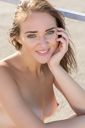 Oxana Chic - Enjoying the sunny day while naked on the beach