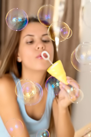 Baby Shine Slim brunette undresses when playing with soap bubbles
