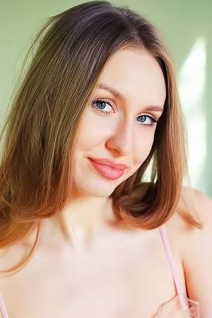 Lia Pink Kneels To Offer An Enticing Rear View Of Her Voluptuous Booty