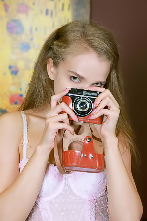 Xenia Glancing Back Over Her Shoulder With A Flirtatious Smile